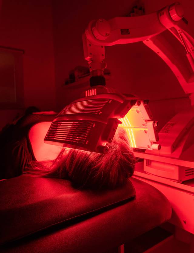 Person receiving Omnilux facial treatment at Blemish Clinic in Lancashire.